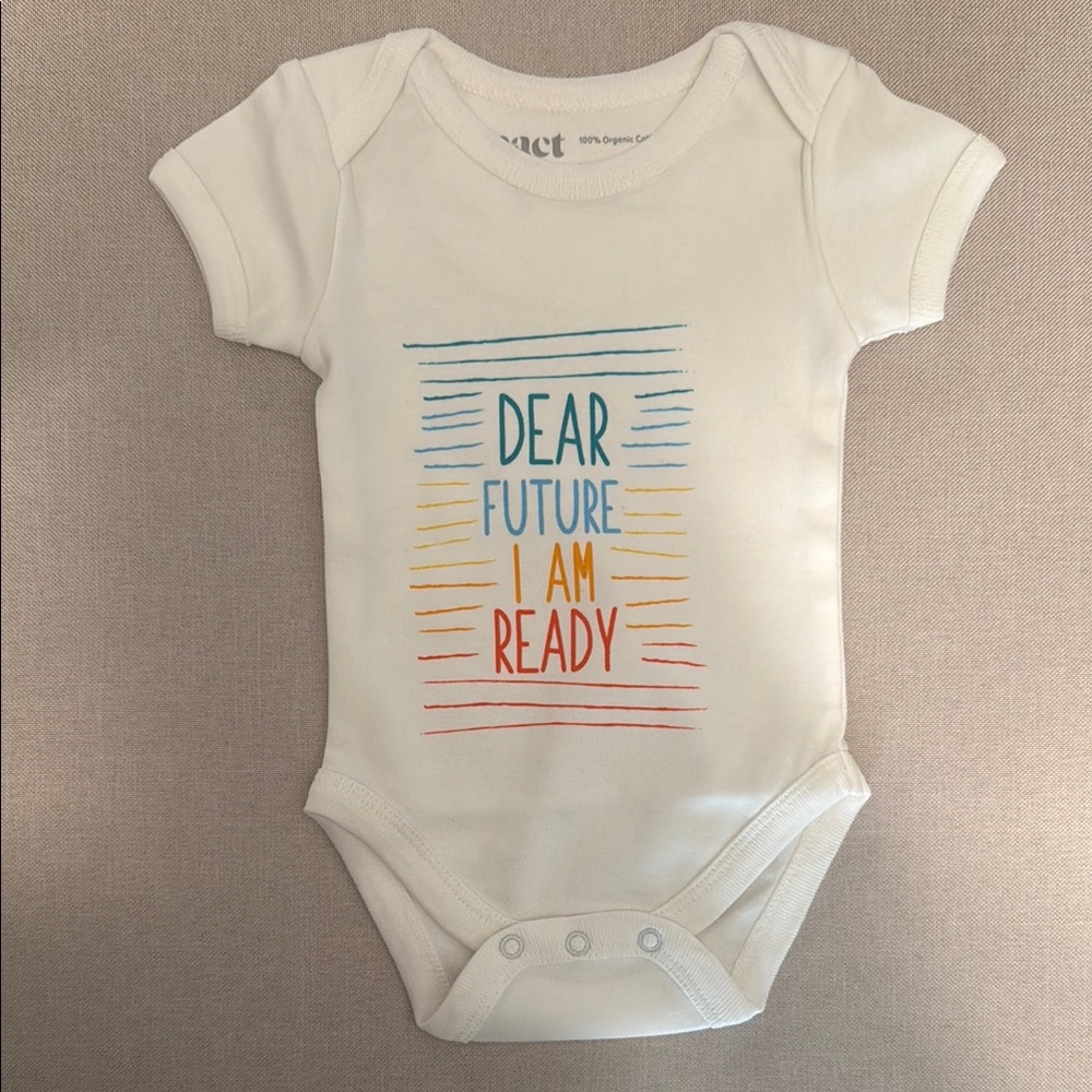 Pact newborn onesie